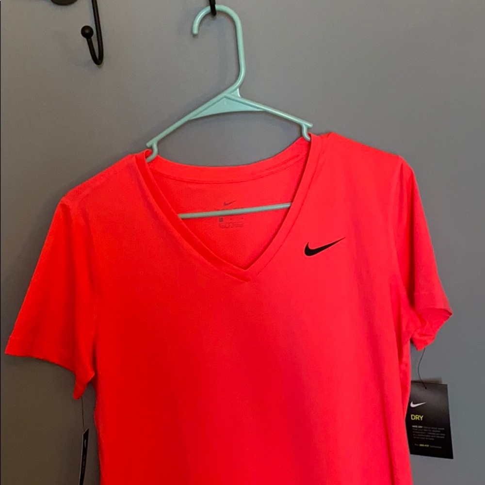 Brand new pink nike shirt. Still with tags